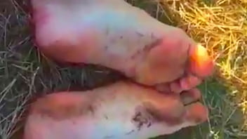 Foot fetish video rubbing feet in mud outdoors