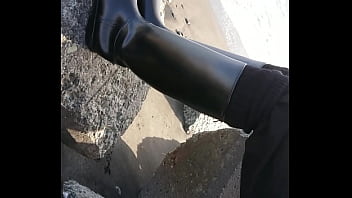 Fetish rubber boots at beach Fetish rubber boots at beach