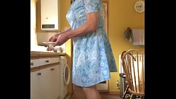Johanna poses in kitchen in blue dress wash up time Johanna poses in kitchen in blue dress wash up time