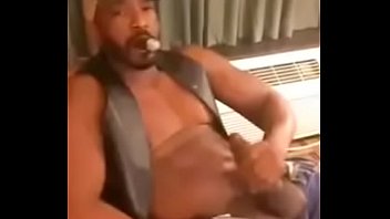 Black leather daddy smokes n strokes
