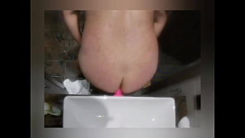 Toying ass with pink dildo in bathroom Toying ass with pink dildo in bathroom