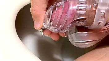 Dripping urine in chastity cage Dripping urine in chastity cage