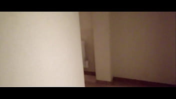 Milf in stockings and heels walks through the corridors of a hotel