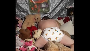Sissy riding stuffy in a bambino diaper Sissy riding stuffy in a bambino diaper