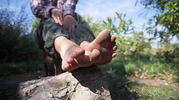 Sexy babe teases her dirty feet outdoors Sexy babe teases her dirty feet outdoors