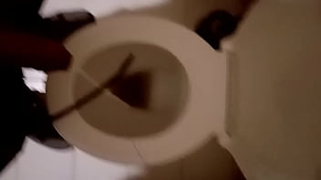 Guy pissing in a toilet