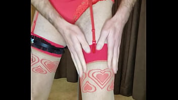 Man dressed in red womans underwear preparing for valentines day Man dressed in red womans underwear preparing for valentines day