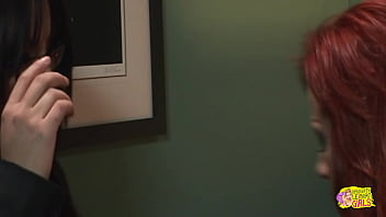 A sexually aroused homosexual woman forcefully inserts a large artificial phallus into the posterior of her red-haired companion with a substantial buttocks