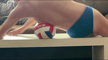 On the table in tight briefs with volleyball for muscle compression and myofascial unwinding - clips