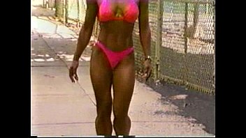 Fitness girl showing off great body outdoors