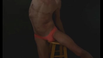Part 2 - down in the dark - sneak a peek preview - groin stretching on the stool with dark background and bright briefs - with the light off