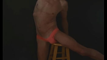 Part 2 - down in the dark - sneak a peek preview - groin stretching on the stool with dark background and bright briefs - with the light off