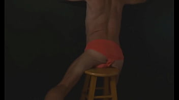 Part 2 - down in the dark - sneak a peek preview - groin stretching on the stool with dark background and bright briefs - with the light off