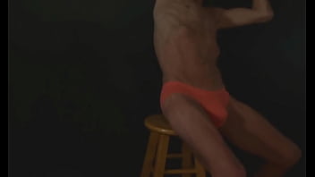 Part 2 - down in the dark - sneak a peek preview - groin stretching on the stool with dark background and bright briefs - with the light off