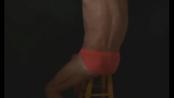 Part 2 - down in the dark - sneak a peek preview - groin stretching on the stool with dark background and bright briefs - with the light off