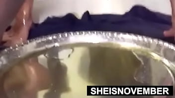 Chubby black hottie msnovember squatting and covered in oil with saggy titties and nipples exposed while pee peeing on sheisnovember