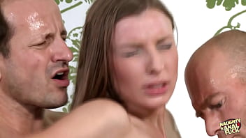 A red-haired mature woman participating in a threesome including double penetration really enjoys being ejaculated upon