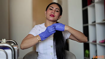 Nurse wears latex gloves