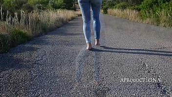 Wetting her jeans on a bare foot hike