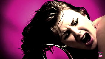 A mischievous brunette wearing lingerie applies oil to her partner's penis and then proceeds to sit on it