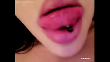 Sexy girl teases the camera by making licking motions