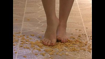 Foot fetish - sexy feet stepping on crunchy cereal