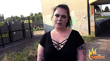 Tattooed slut sucks stranger's dick in public