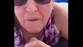 Milf sucks outside