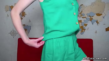 Chestnut ukrainain amateur milf in green shorts and blouse strips off and naked boobs covers with hand while chatting with viewers