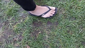 asian feet in flip flops lick