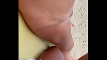 wife jerking husband at beach