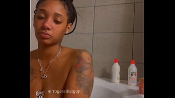 two black naked woman touching public