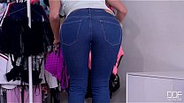 Sexy salesgirl help to a customer not only with the clothes