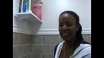 Cutie in jeans is on the toilet and rubbing her shaven pussy