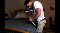 Skater Guy Sniffing his own Skate Shoes