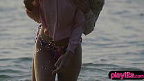 Petite girls having a lesbo affair at the beach