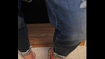 Trashed sneakers and jeans