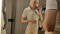 Hot babe tries on sexy clothes and flashes her boobs. Clothes fitting in the fitting room