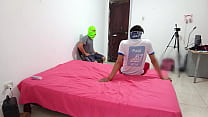 The Indian woman flirts with two men while filming her porn scene and fucks with a skin-colored dildo.
