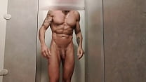 muscled guy jerks off in gym shower