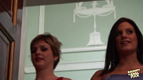 After these two females rang a bell, a group of men arrived and engaged in vigorous sexual activity with them