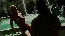 Blonde with massive boobs riding cock by the pool