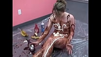 Veronica Snow gets covered in ketchup and poses for the camera on the floor