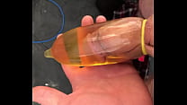 Filling a rubber full of piss