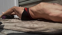 Stretching and Writhing for mayofascial release on Patio in Underwear