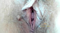 MILF caresses her hairy pussy