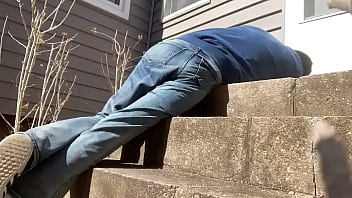 Mayofascial stretch of leg and side on cement steps