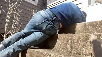 Mayofascial stretch of leg and side on cement steps