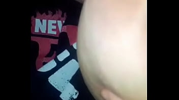 Horny bitch sucking her tittie