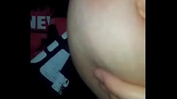 Horny bitch sucking her tittie